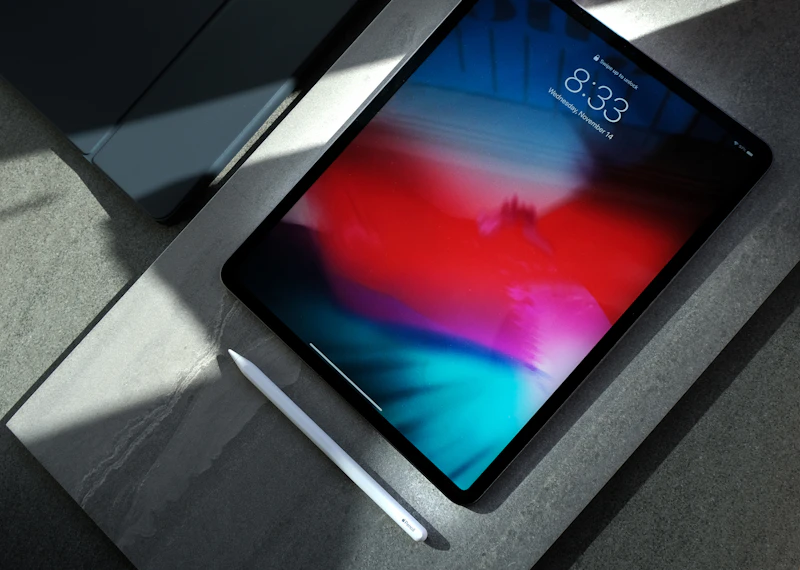 Tablet and pencil on a stone desk